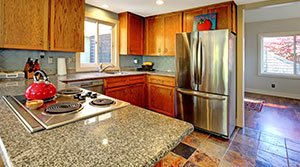 Kitchen with Granite Counter and Cooktop
